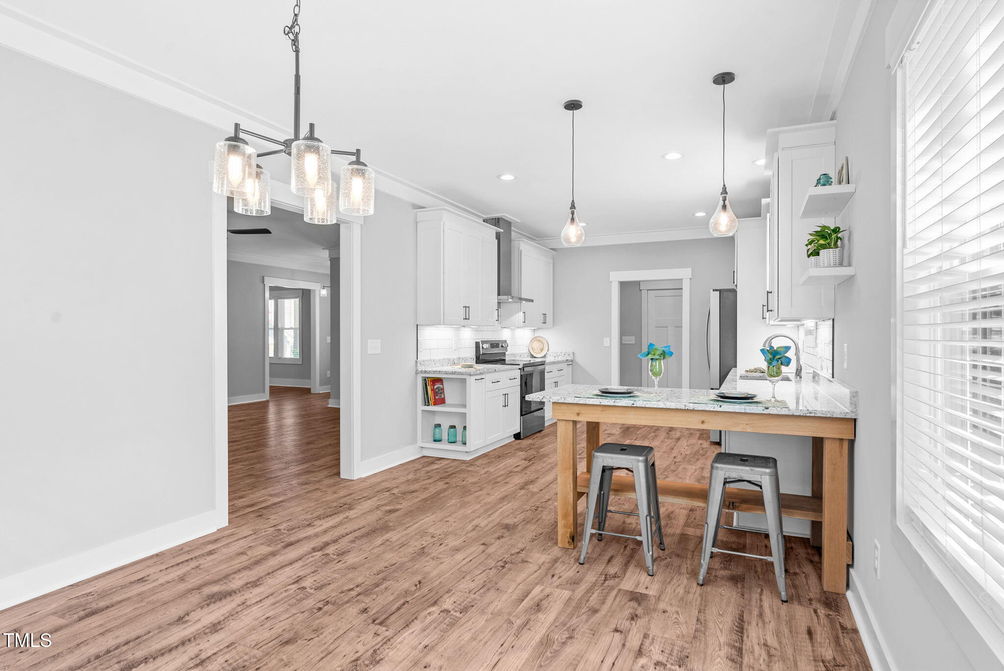 1004 Snow Peak Court Raleigh, NC 27603 - Photo 29 of 65 a large kitchen with a table and chairs