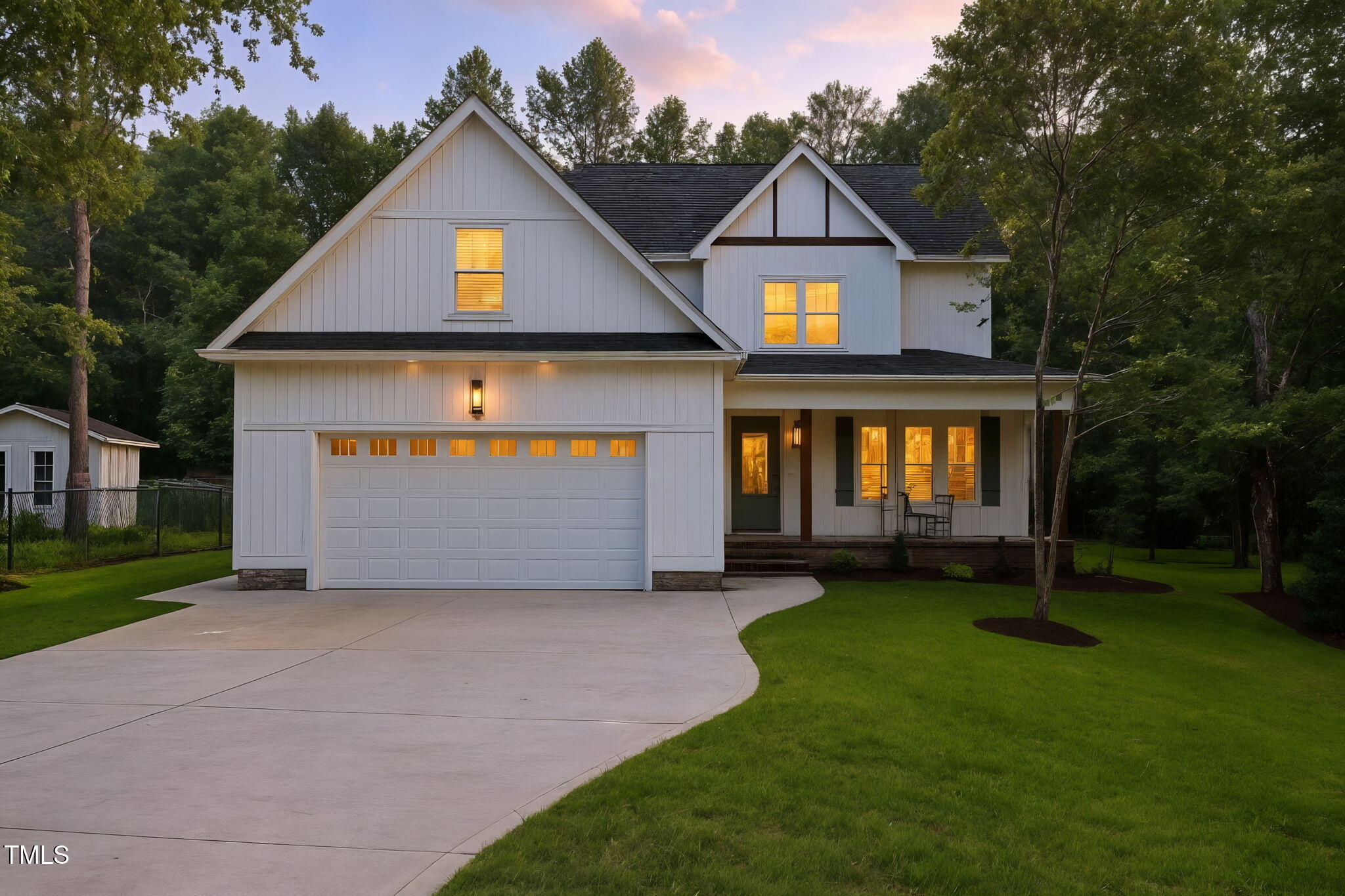 1004 Snow Peak Court Raleigh, NC 27603 - Photo 2 of 65 a front view of a house with a yard and garage