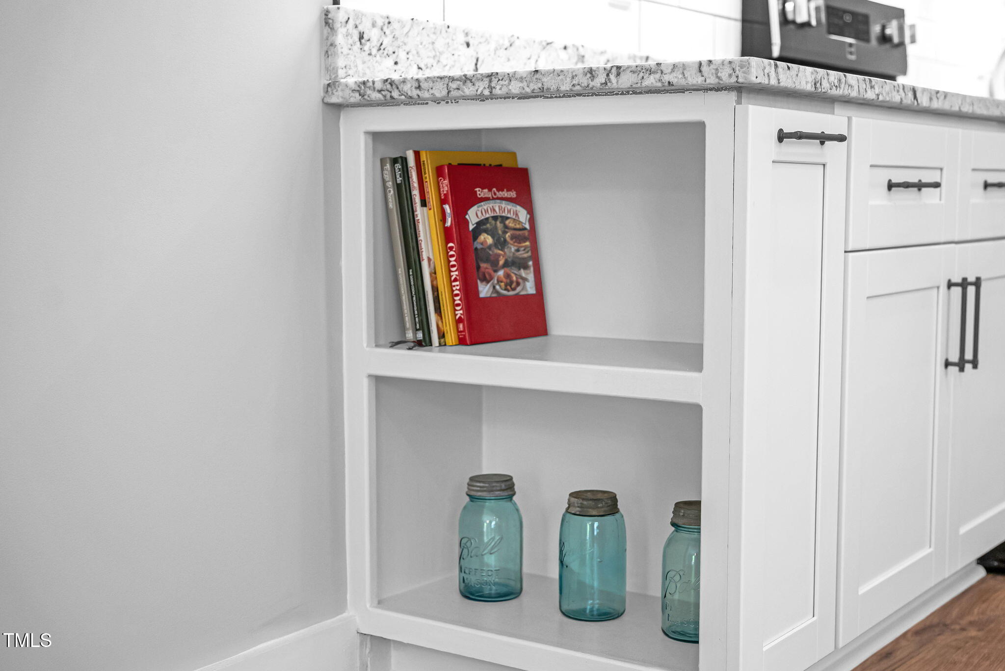 1004 Snow Peak Court Raleigh, NC 27603 - Photo 32 of 65 a utility room with two painting on the wall and a potted plant