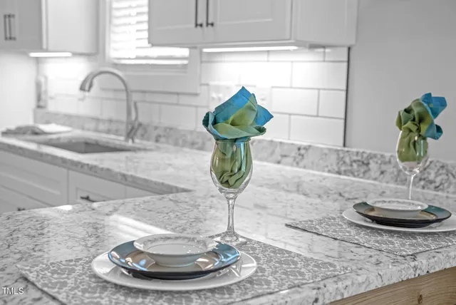 a view of a bedroom with wooden floor and balcony