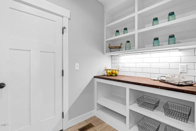 a house with trees in the background