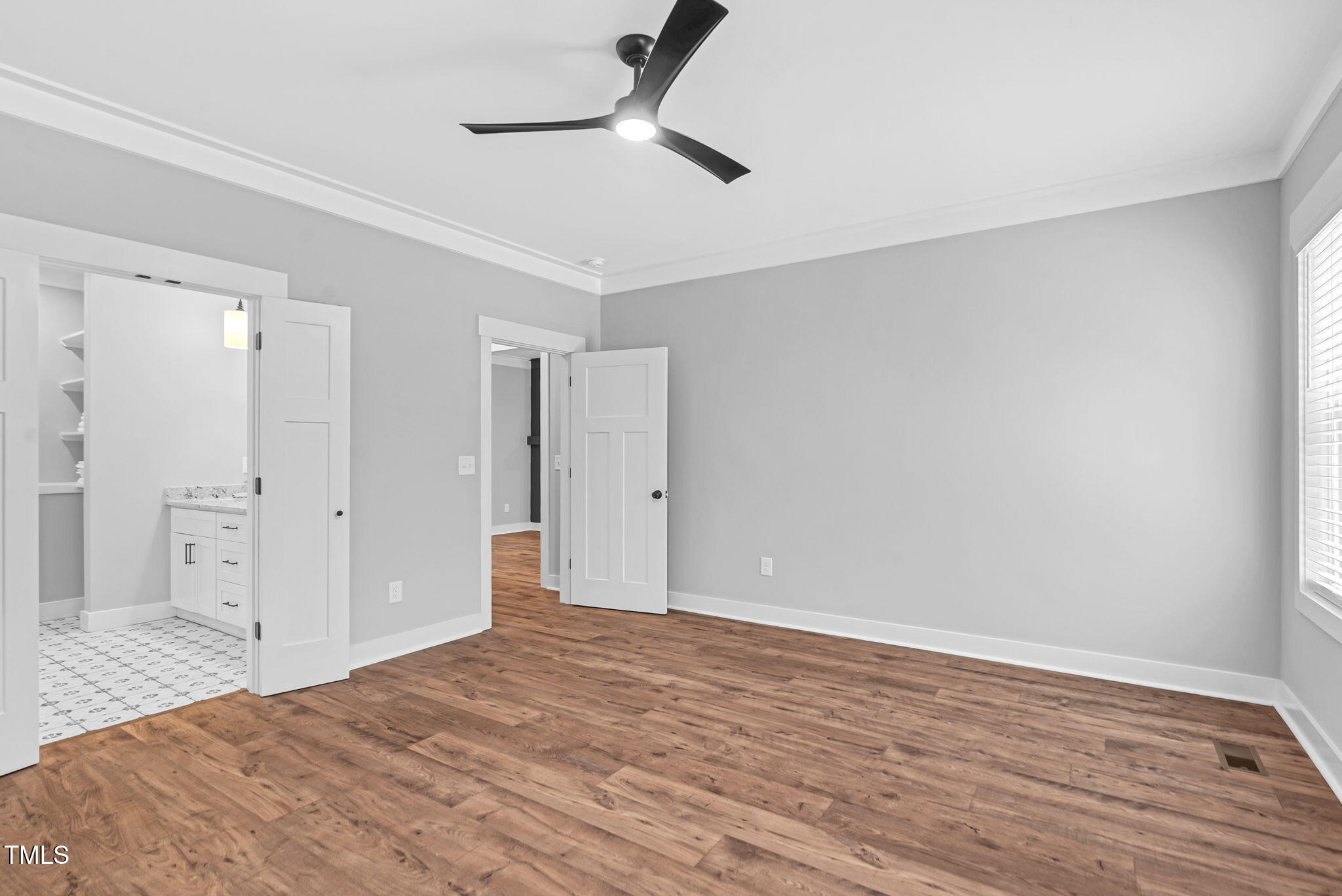 1004 Snow Peak Court Raleigh, NC 27603 - Photo 41 of 65 a big room with wooden floor and bathroom view