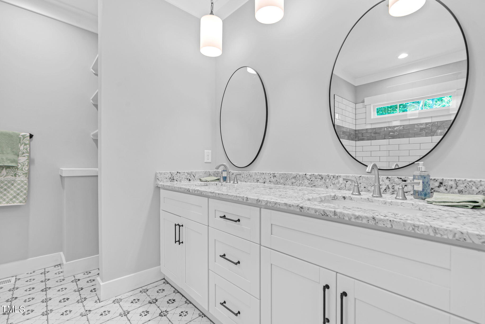 1004 Snow Peak Court Raleigh, NC 27603 - Photo 43 of 65 a bathroom with a granite countertop sink and mirror