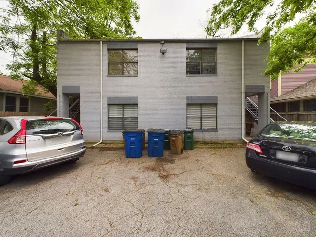 a view of a car park in front of house