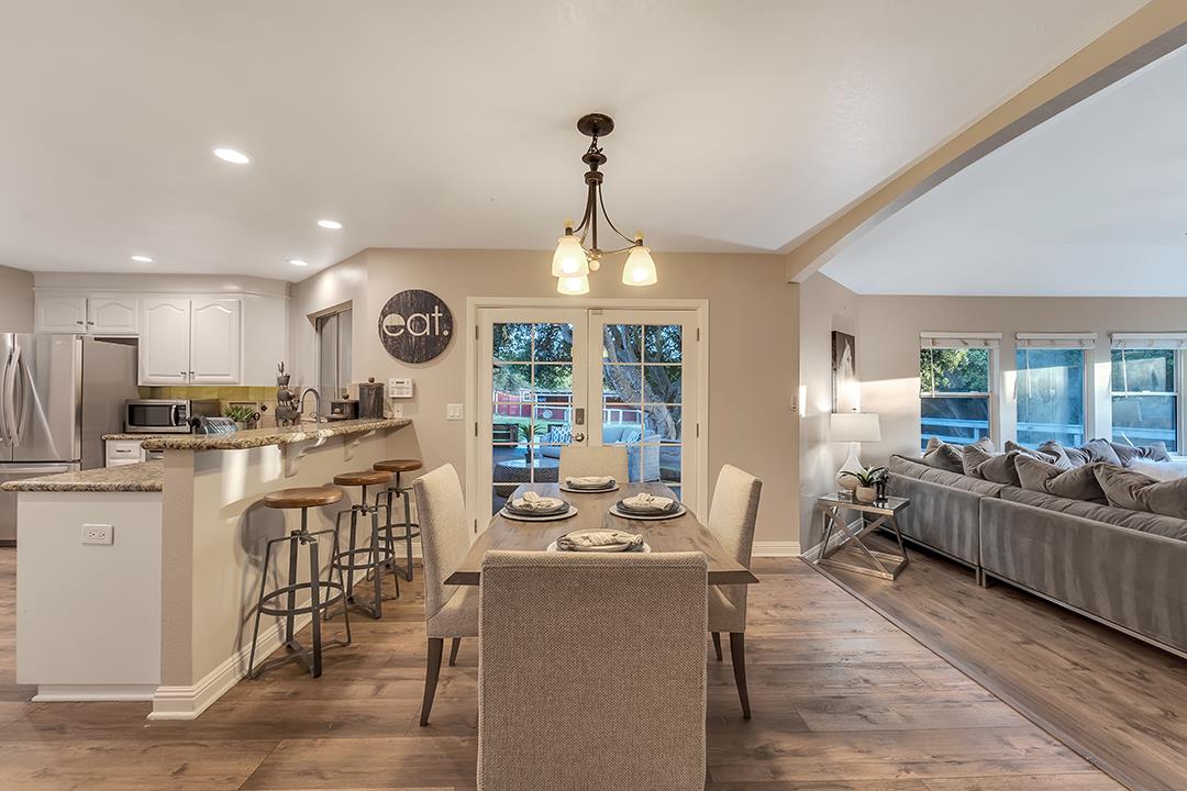 8640 Dyer Road Prunedale, CA 93907 - Photo 13 of 61 a view of a dining room with furniture window and wooden floor