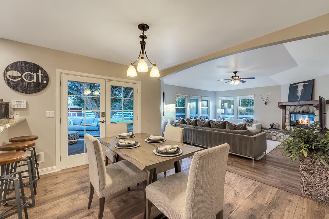 8640 Dyer Road Prunedale, CA 93907 - Photo 14 of 61 a view of a dining room with furniture large window and wooden floor