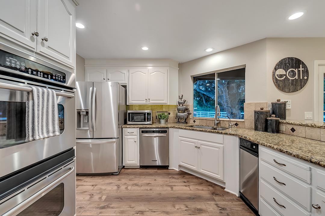 8640 Dyer Road Prunedale, CA 93907 - Photo 18 of 61 a kitchen with granite countertop stainless steel appliances a sink and a refrigerator