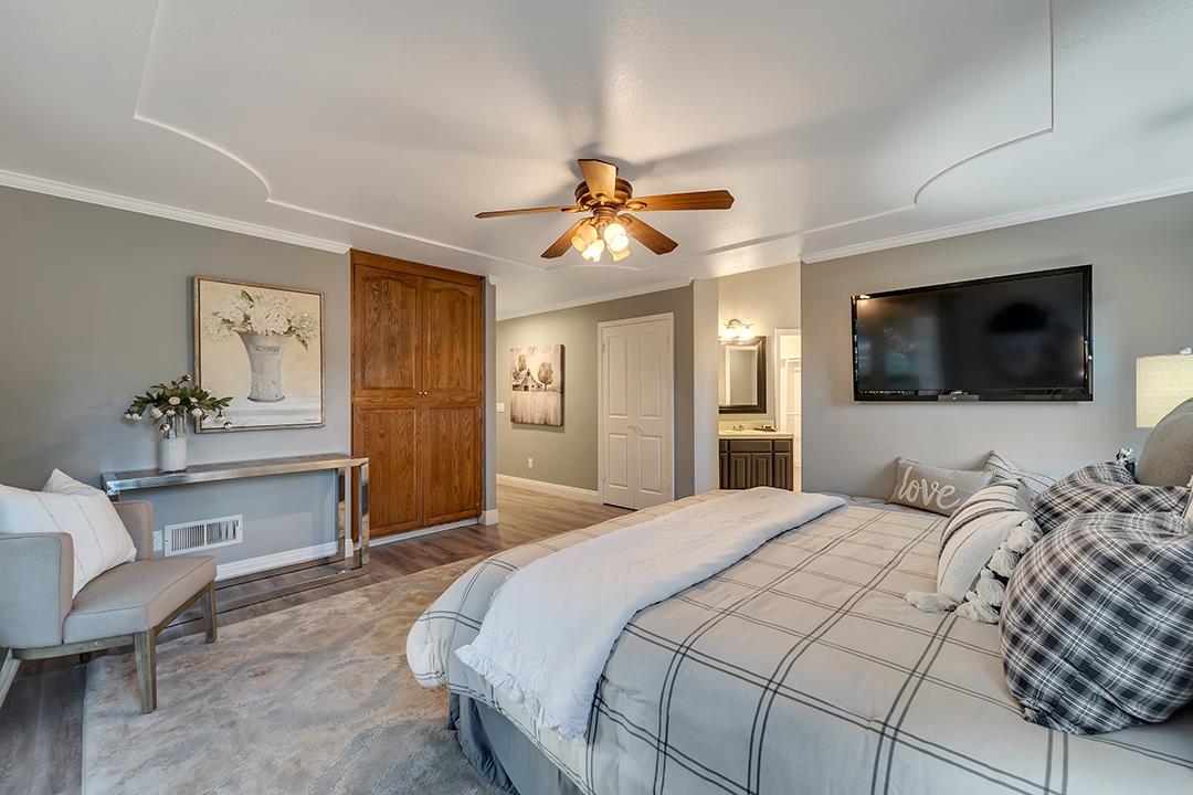 8640 Dyer Road Prunedale, CA 93907 - Photo 29 of 61 a bedroom with a bed and a flat screen tv