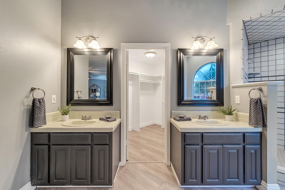 8640 Dyer Road Prunedale, CA 93907 - Photo 30 of 61 a bathroom with a sink vanity and a mirror