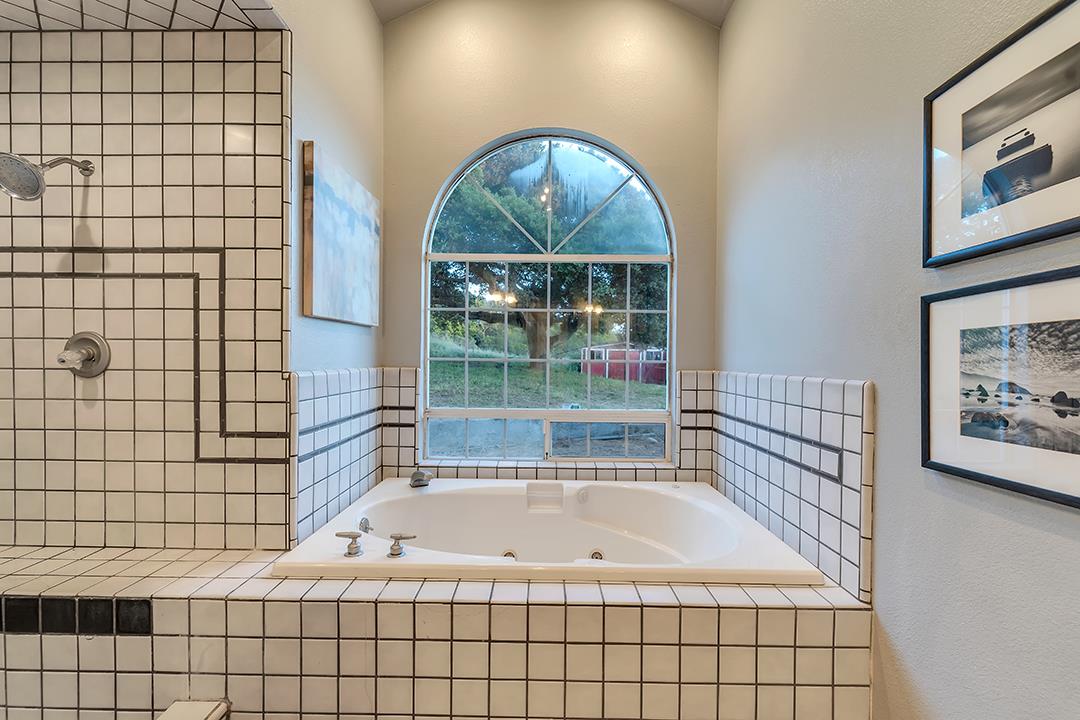8640 Dyer Road Prunedale, CA 93907 - Photo 34 of 61 a bath tub sitting next to a window