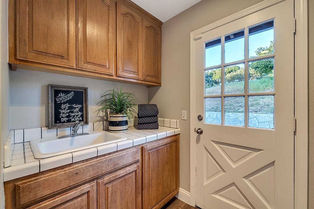8640 Dyer Road Prunedale, CA 93907 - Photo 37 of 61 a kitchen with stainless steel appliances granite countertop a sink and cabinets
