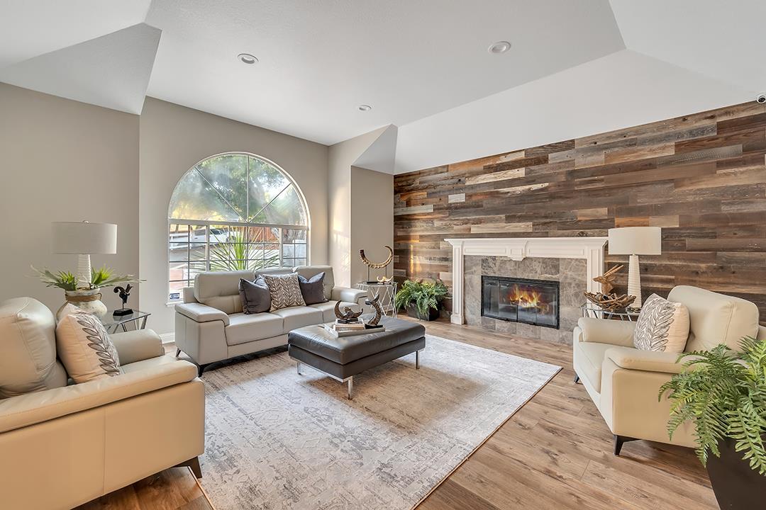 8640 Dyer Road Prunedale, CA 93907 - Photo 10 of 61 a living room with furniture a fireplace and a large window