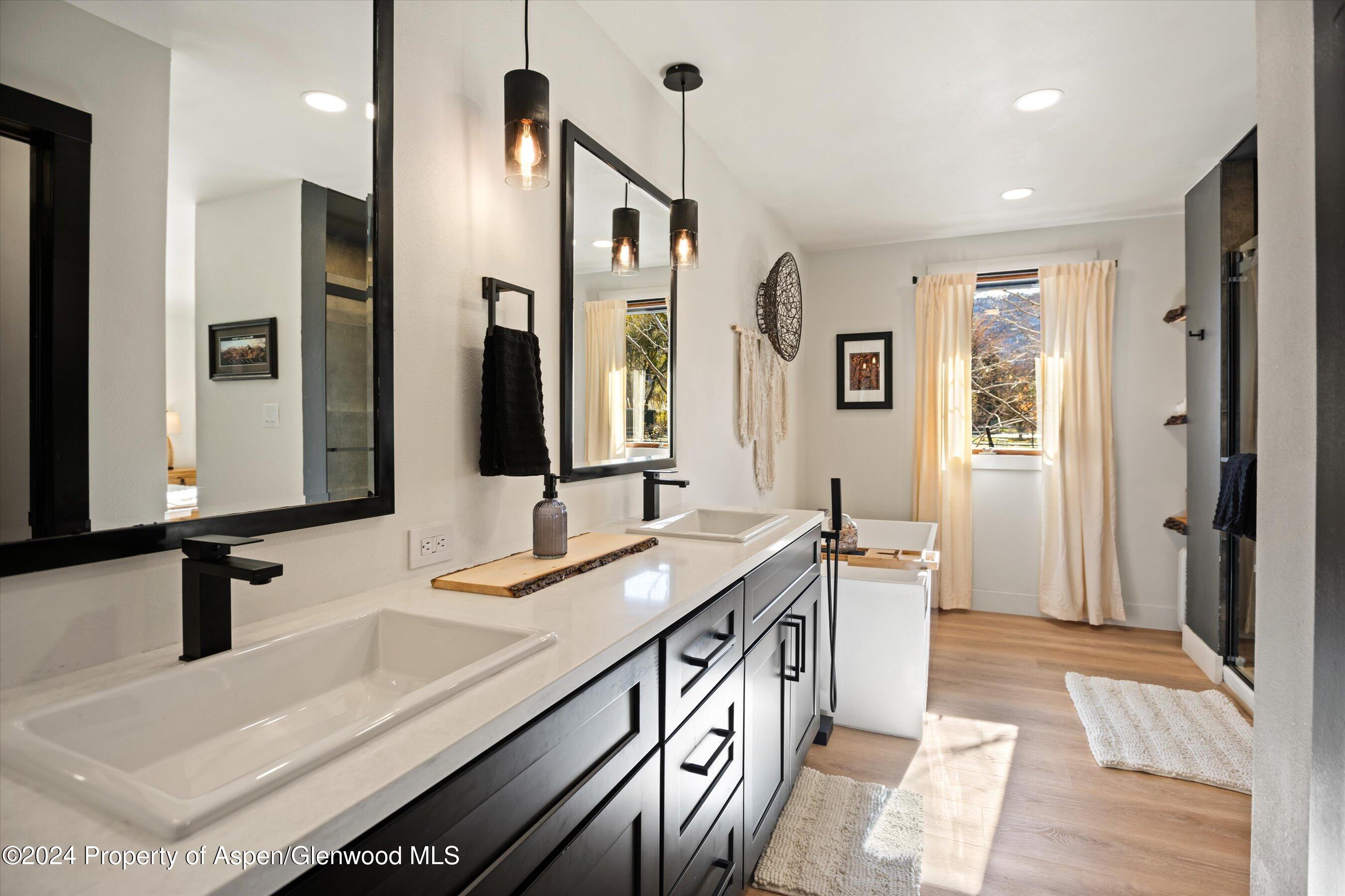 24 Cherry Lane Basalt, CO 81621 - Photo 12 of 42 a bathroom with double vanity and a bathtub