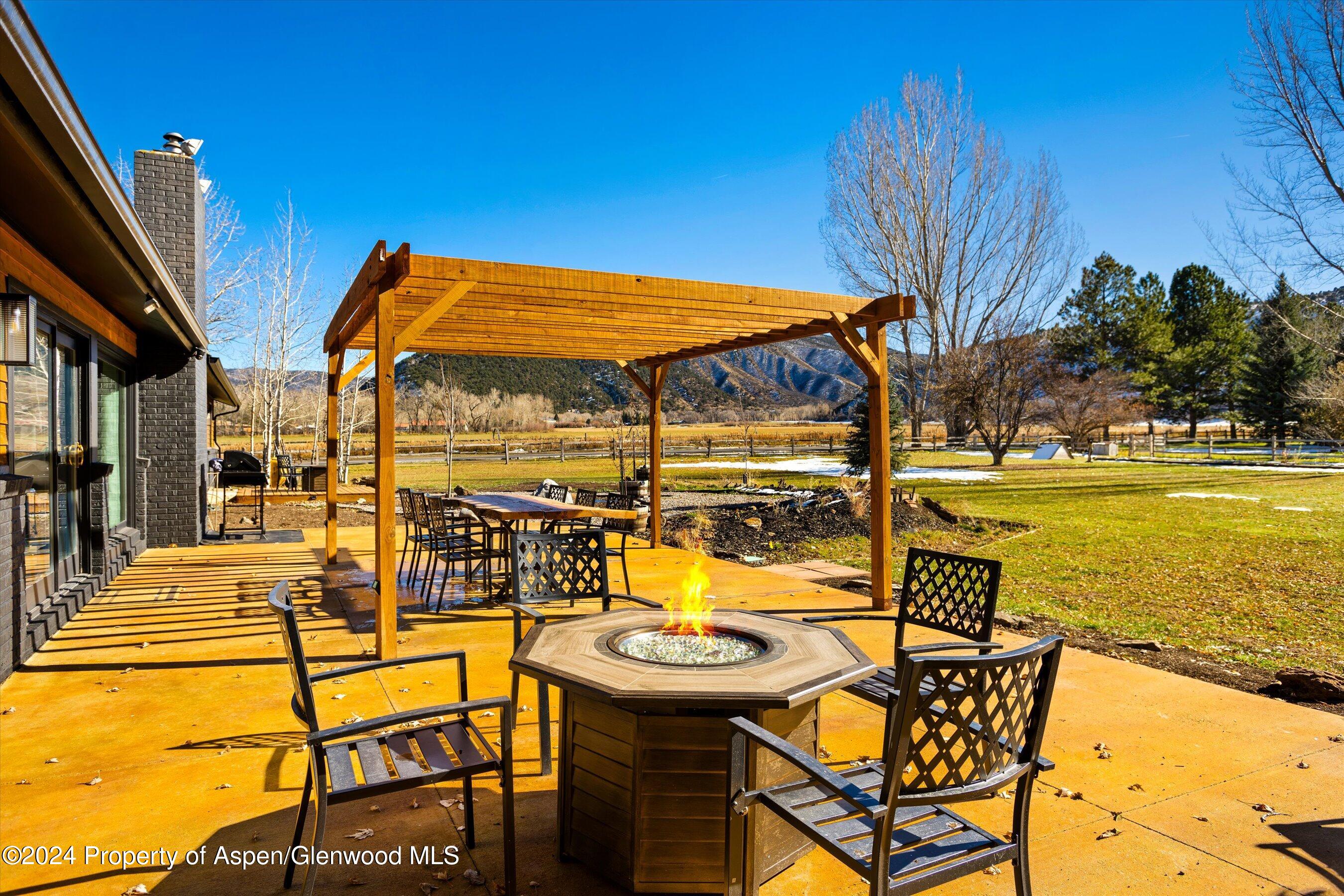 24 Cherry Lane Basalt, CO 81621 - Photo 22 of 42 a view of a swimming pool with an outdoor seating