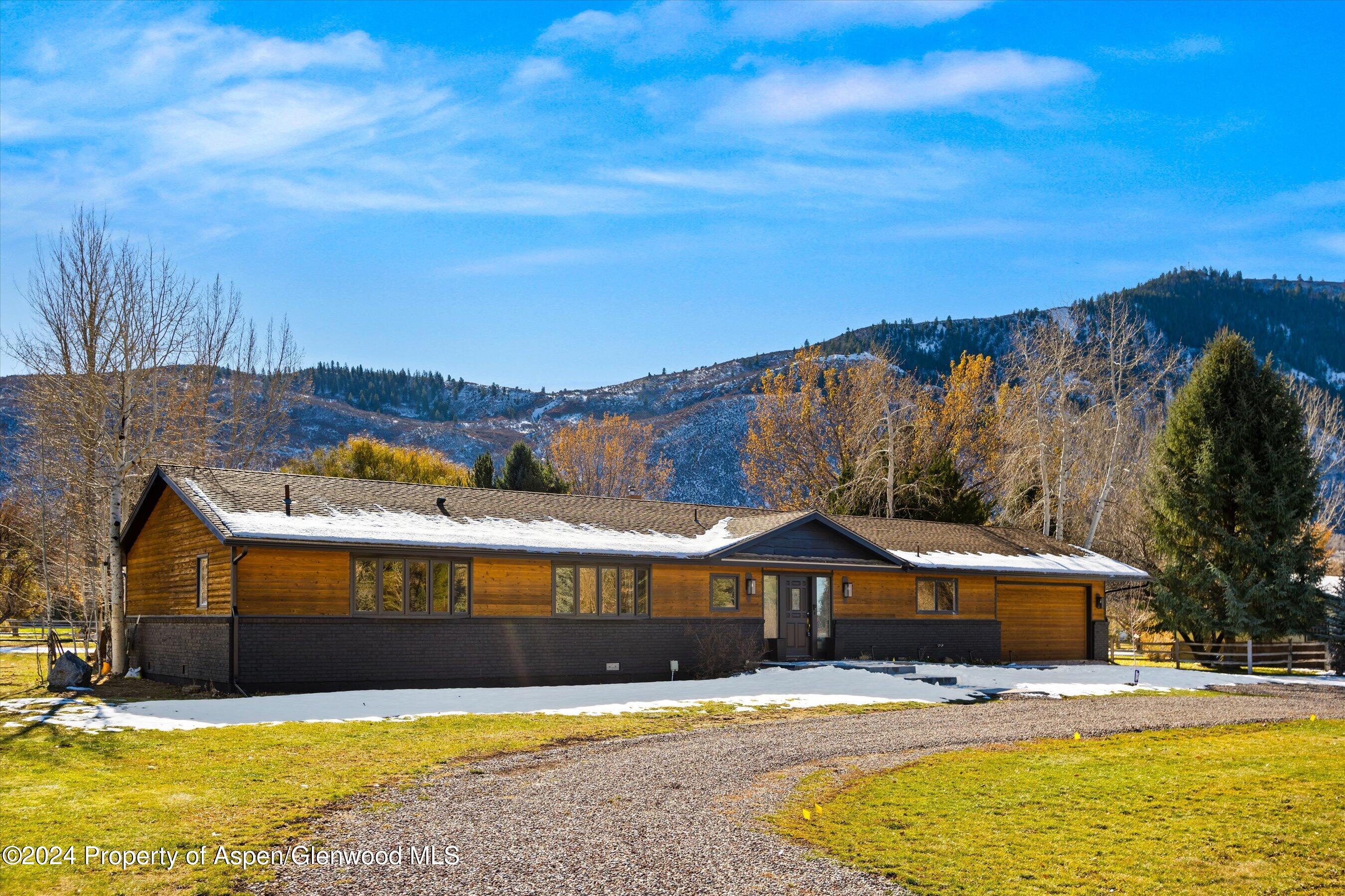 24 Cherry Lane Basalt, CO 81621 - Photo 32 of 42 a view of swimming pool with outdoor seating and house in the background