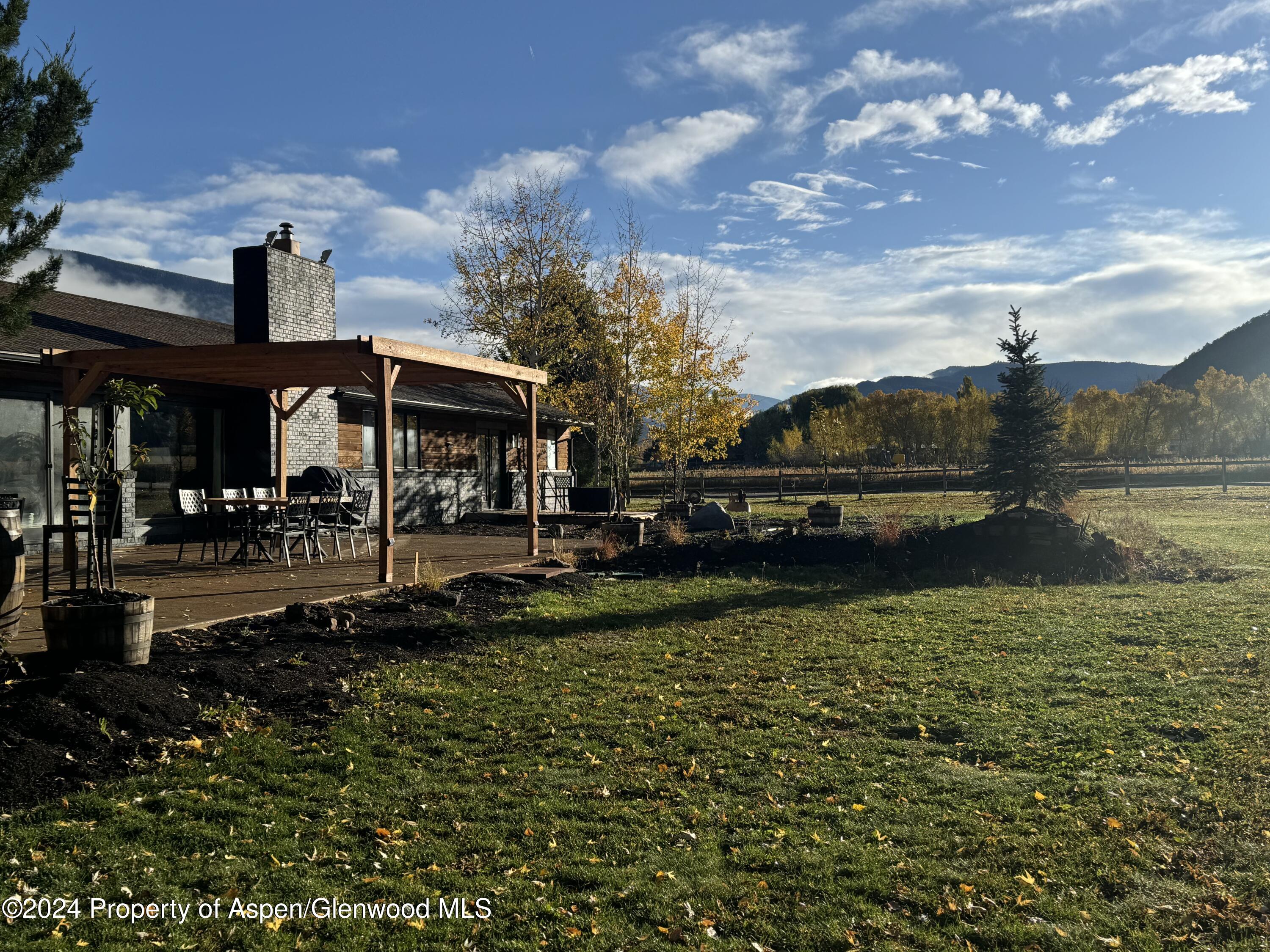 24 Cherry Lane Basalt, CO 81621 - Photo 34 of 42 a view of a lake with a house in the background
