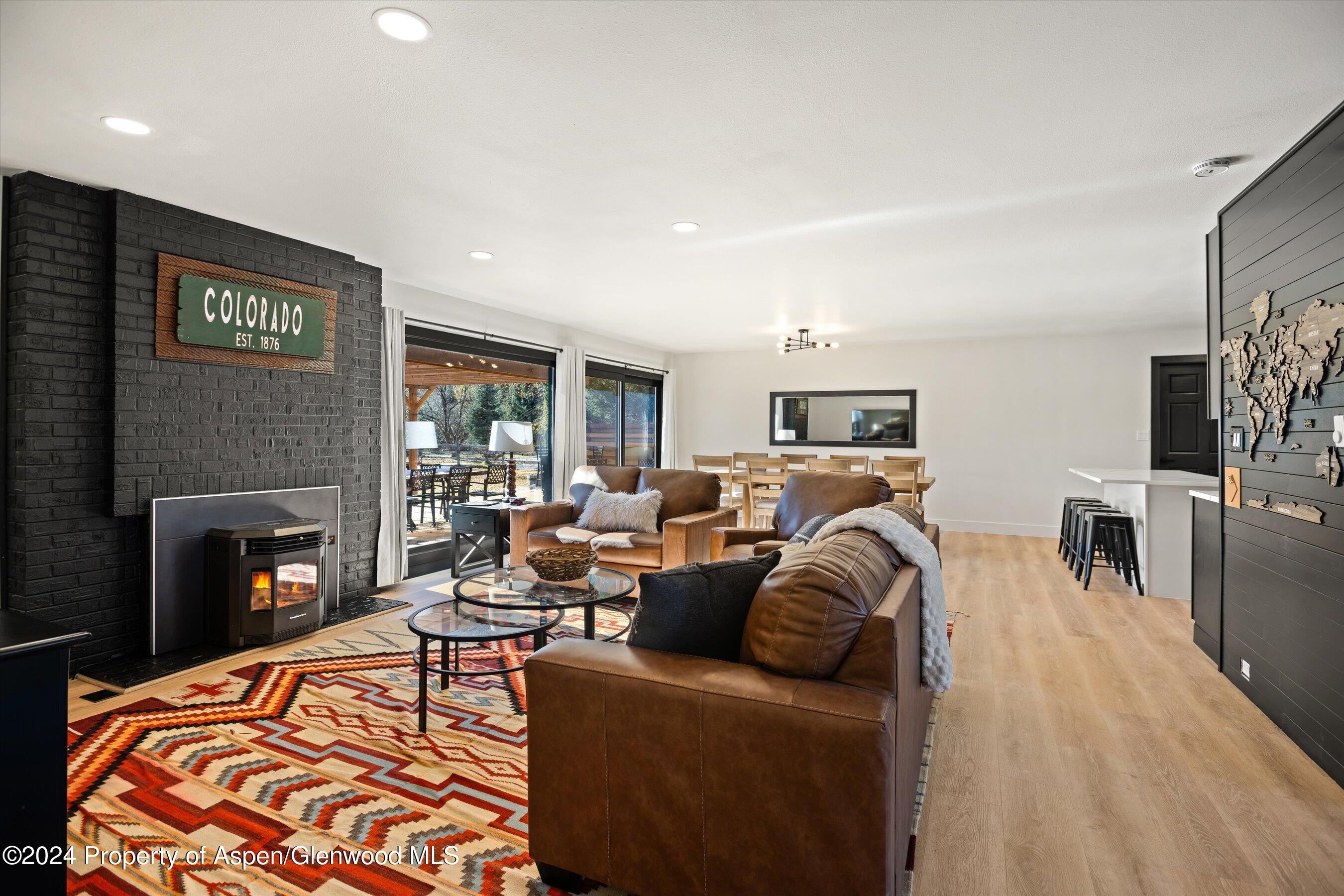 24 Cherry Lane Basalt, CO 81621 - Photo 4 of 42 a living room with furniture a flat screen tv and a fireplace