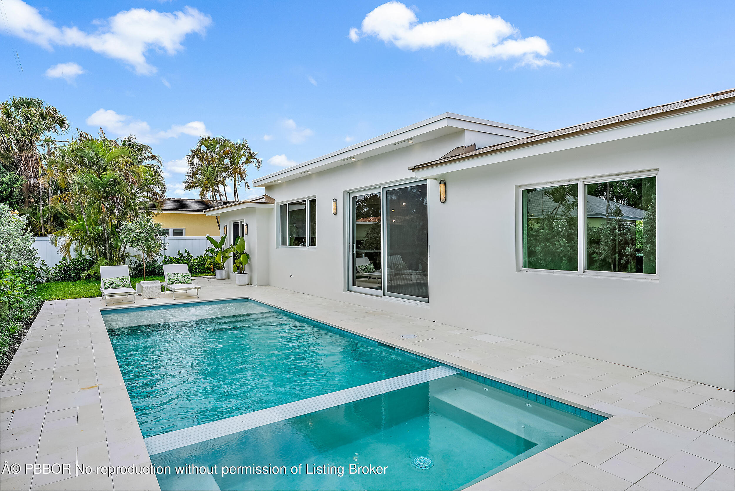 310 Edmor Road West Palm Beach, FL 33405 - Photo 29 of 32 a view of an white house with a backyard