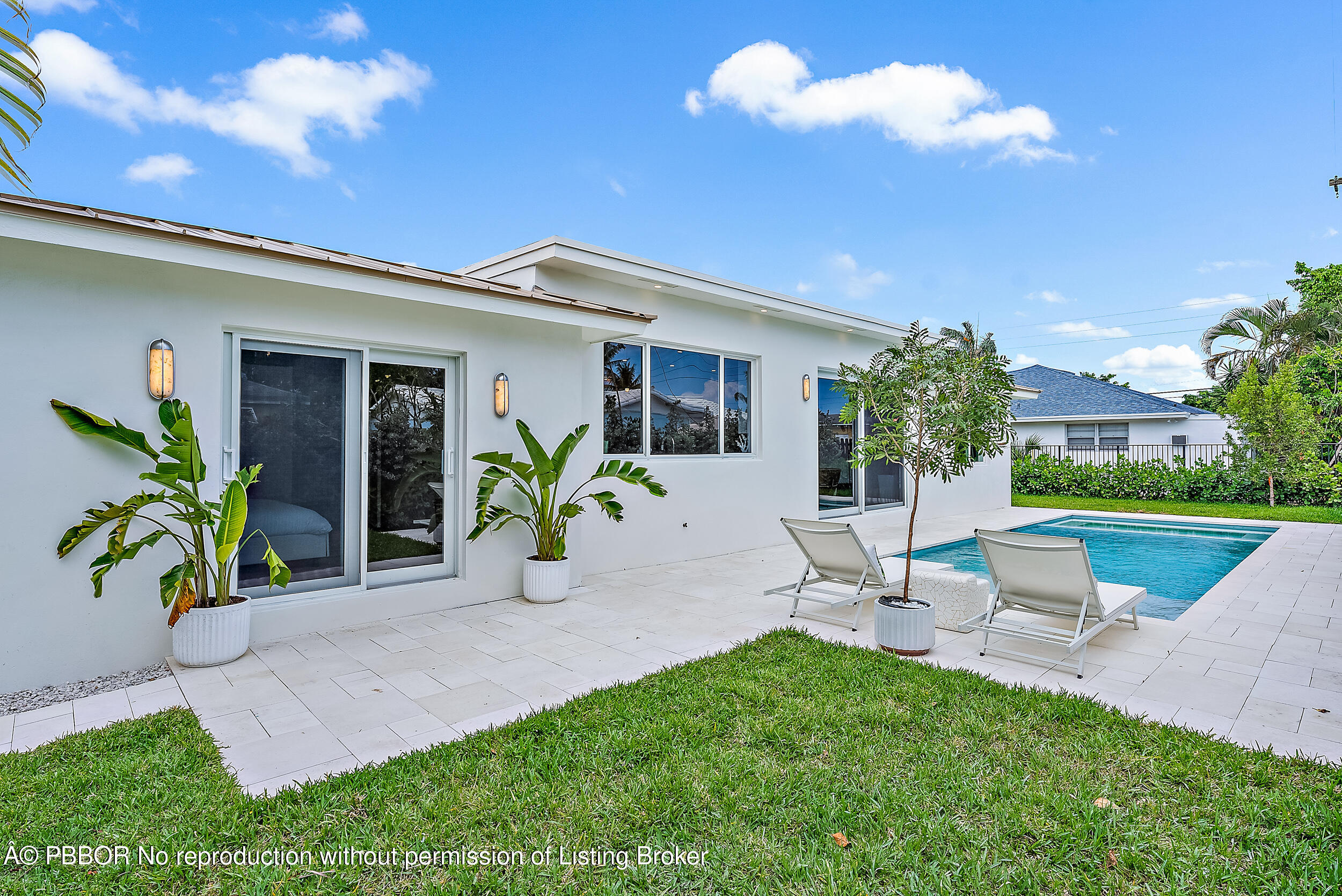 310 Edmor Road West Palm Beach, FL 33405 - Photo 30 of 32 a view of a house with a yard and sitting area