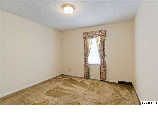 4750 Mechunk Road Keswick, VA 22947 - Photo 15 of 23 a view of an empty room and window