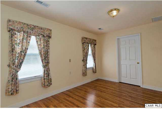 4750 Mechunk Road Keswick, VA 22947 - Photo 19 of 23 a room with a bed and a window