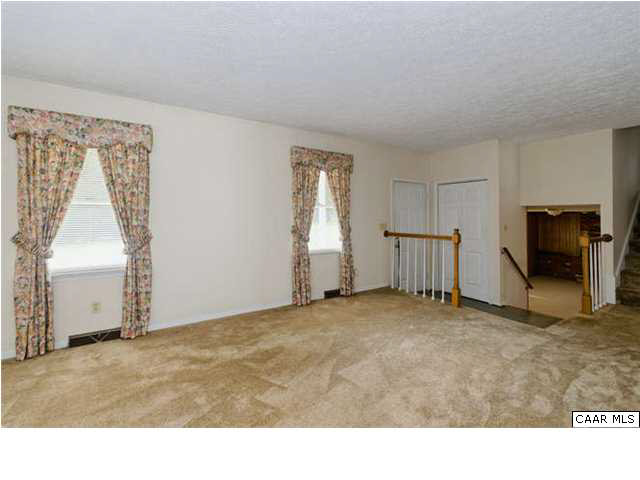 4750 Mechunk Road Keswick, VA 22947 - Photo 4 of 23 a room with a window and a flat screen tv