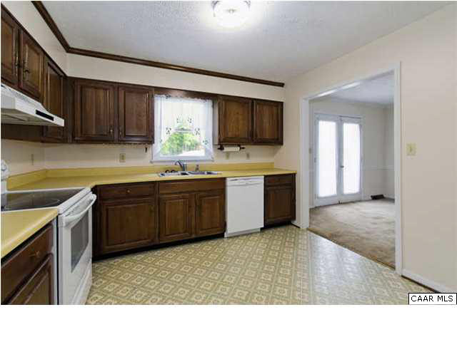 4750 Mechunk Road Keswick, VA 22947 - Photo 7 of 23 a kitchen with a sink and cabinets