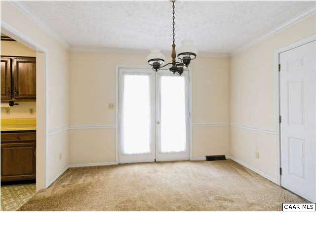 4750 Mechunk Road Keswick, VA 22947 - Photo 8 of 23 a view of a livingroom with a ceiling fan