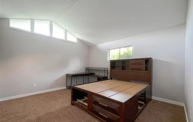 a room with a bed and window