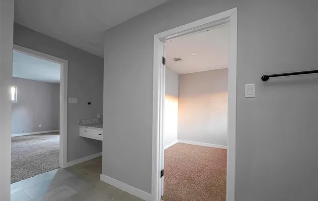 a view of an empty room and a window