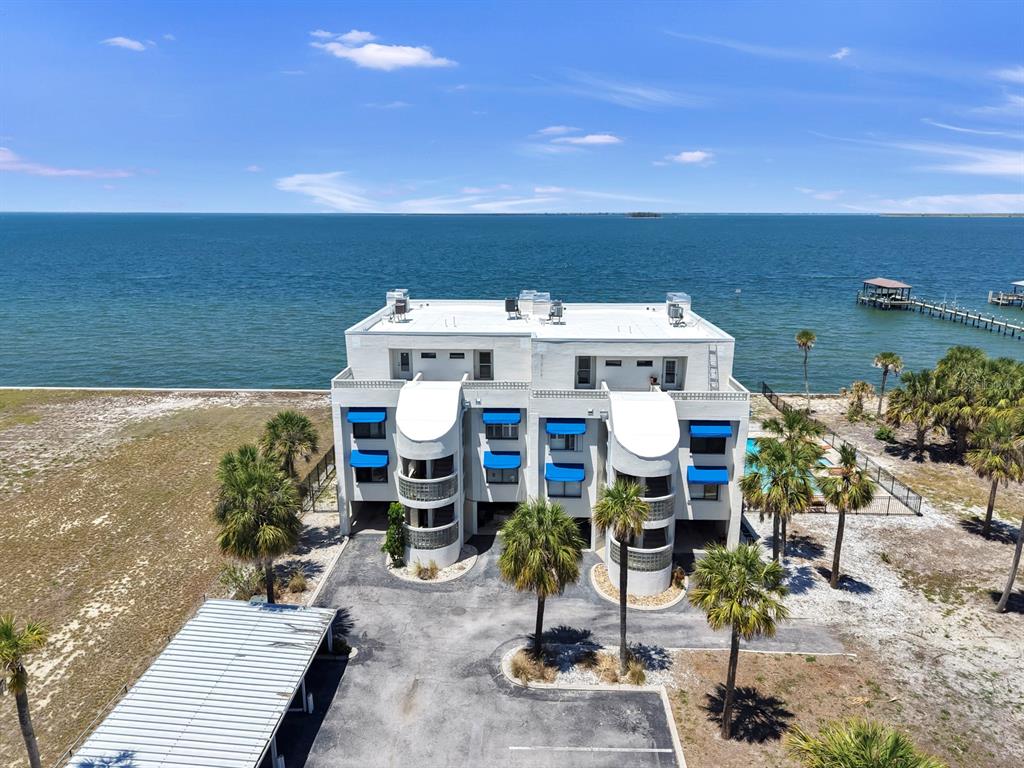 6504 Surfside Boulevard, Unit 4 Apollo Beach, FL 33572 - Photo 1 of 41 an aerial view of a house with swimming pool