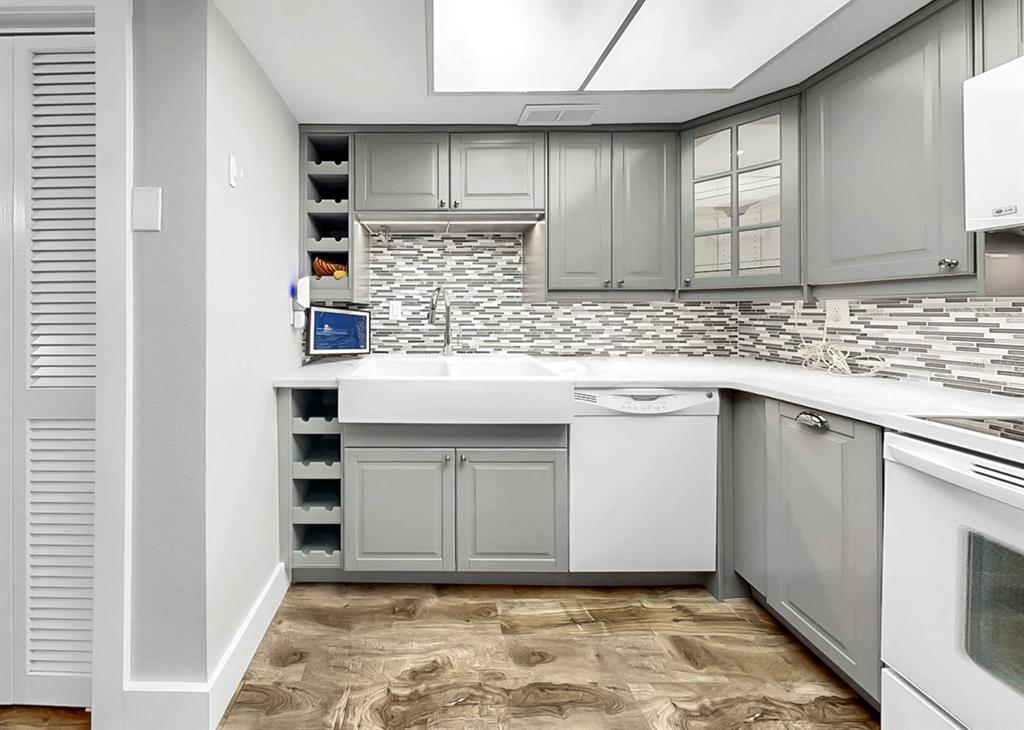 6504 Surfside Boulevard, Unit 4 Apollo Beach, FL 33572 - Photo 17 of 41 a kitchen with stainless steel appliances granite countertop a sink and a stove