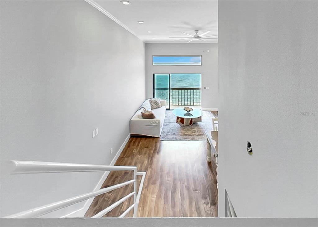 6504 Surfside Boulevard, Unit 4 Apollo Beach, FL 33572 - Photo 24 of 41 a living room with furniture and a large window