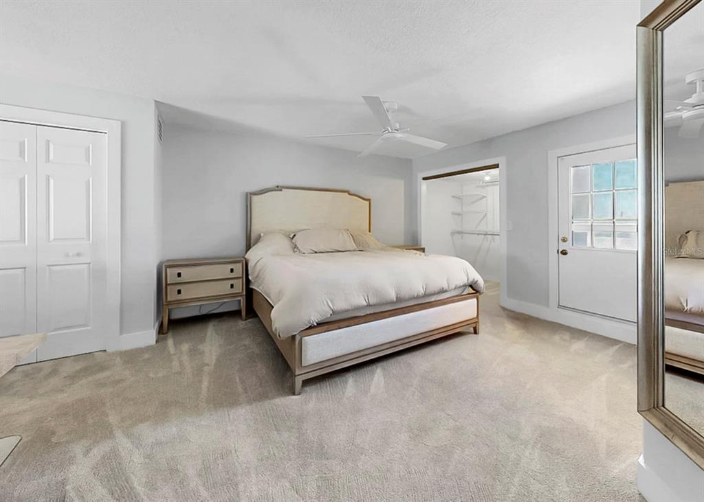 6504 Surfside Boulevard, Unit 4 Apollo Beach, FL 33572 - Photo 28 of 41 a bedroom with a bed and a cabinets