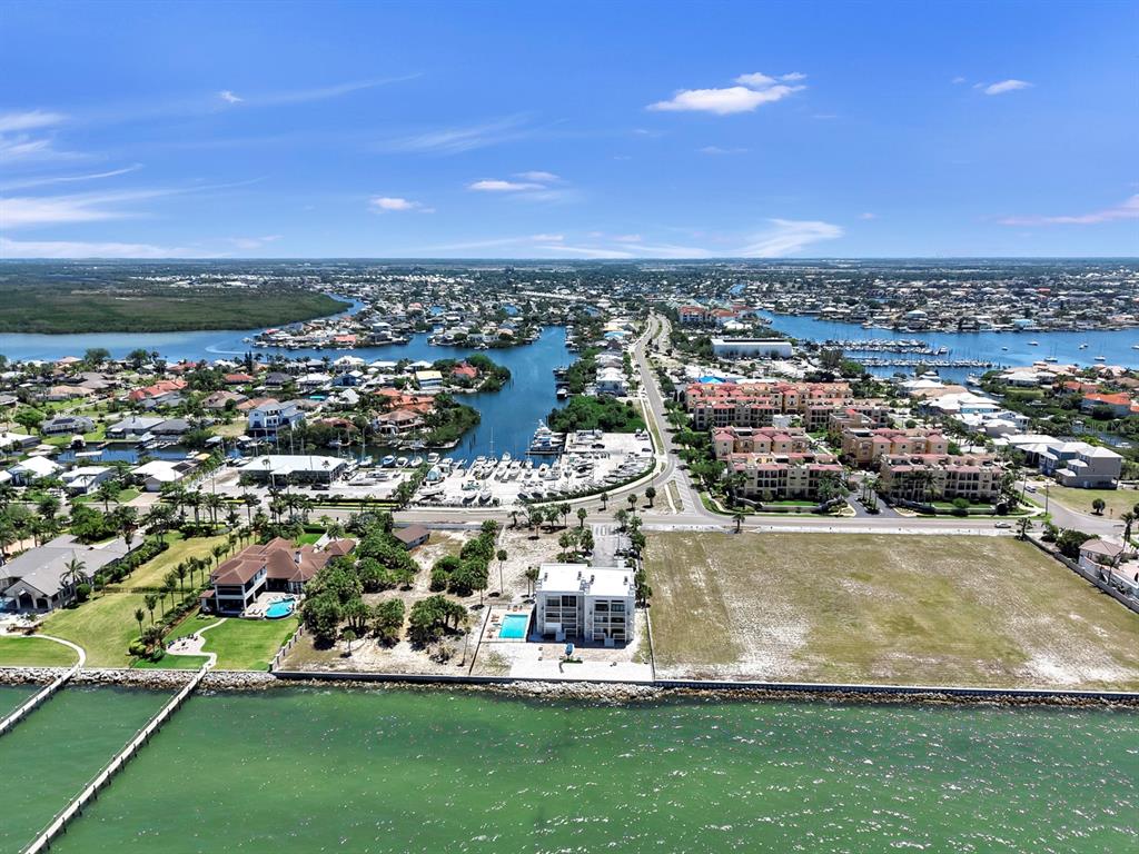 6504 Surfside Boulevard, Unit 4 Apollo Beach, FL 33572 - Photo 3 of 41 an aerial view of residential houses with outdoor space and trees