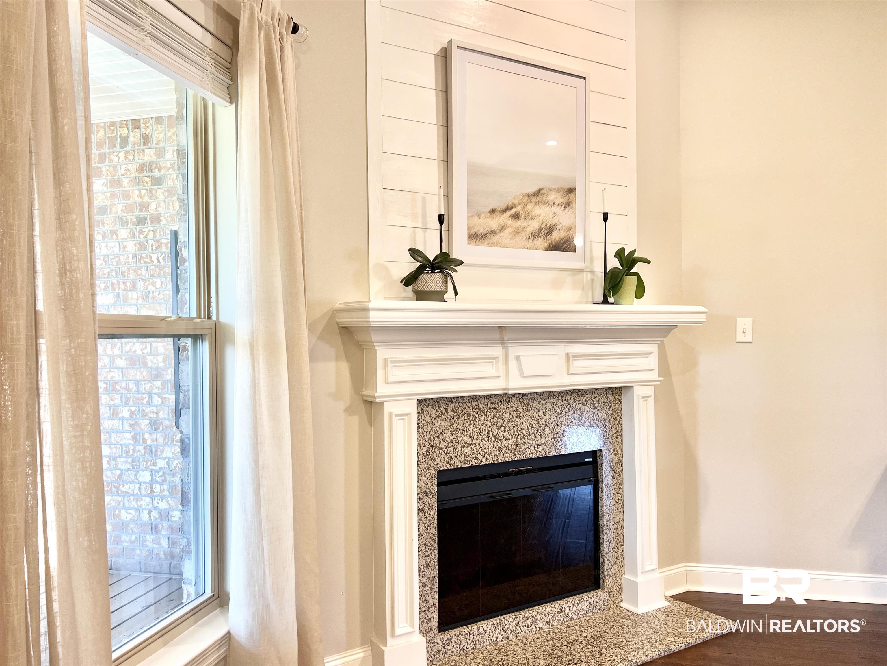 32290 Calder Court Daphne, AL 36527 - Photo 13 of 59 Room details featuring a premium fireplace and wood-type flooring