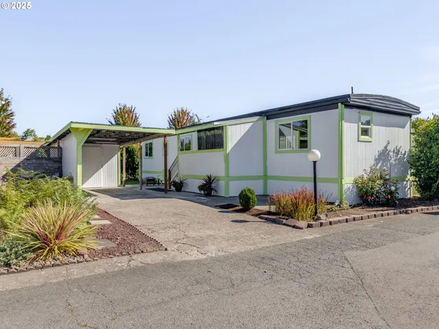 a view of a house with outdoor space and sitting area