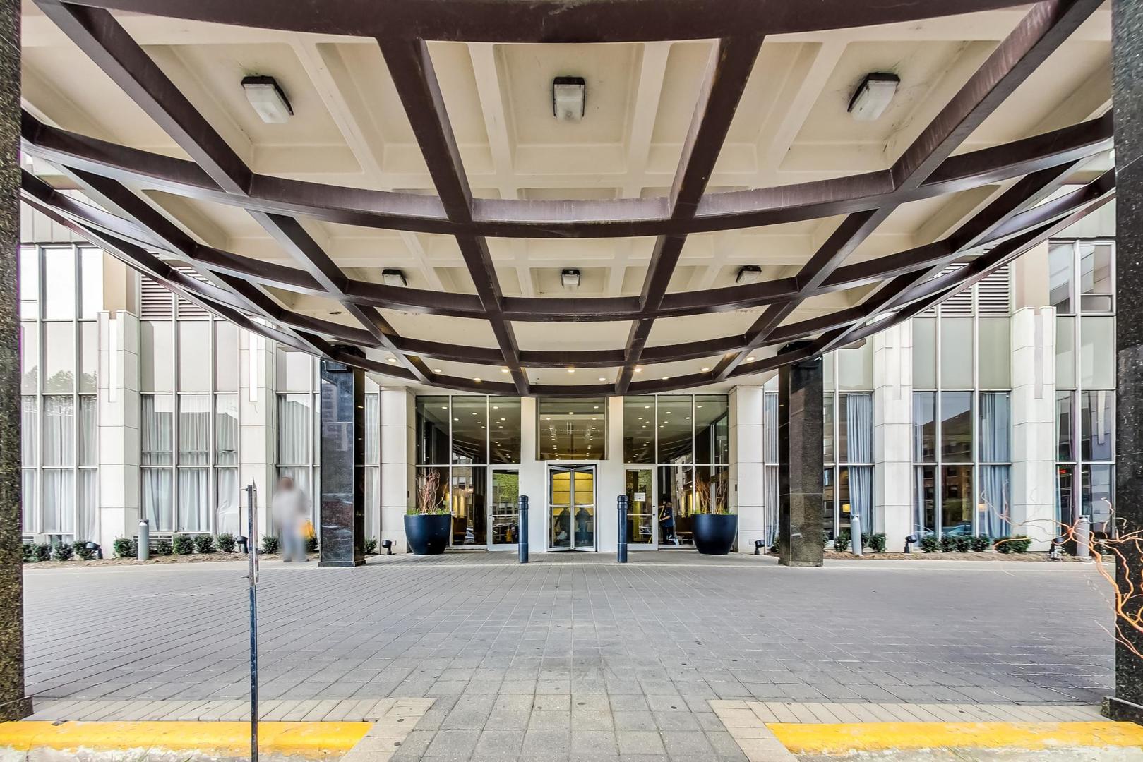 655 West Irving Park Road, Unit 5503 Chicago, IL 60613 - Photo 2 of 32 a view of a building with door and outdoor space