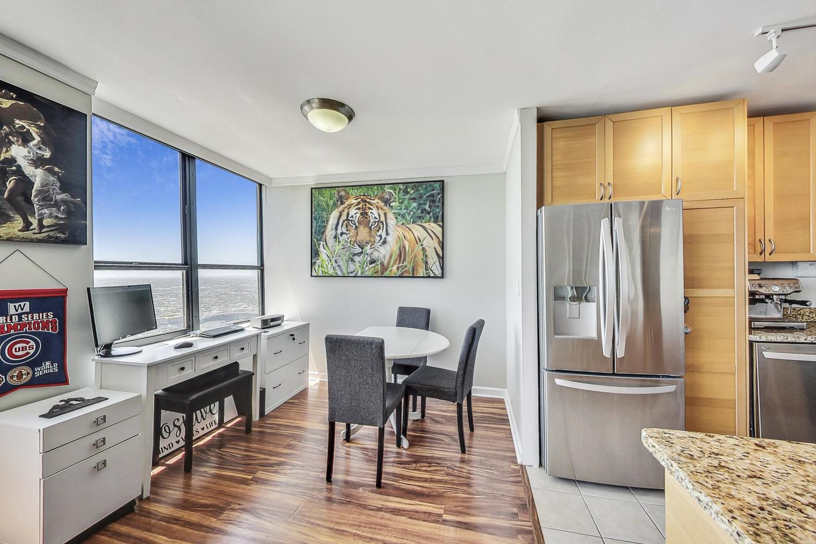 655 West Irving Park Road, Unit 5503 Chicago, IL 60613 - Photo 10 of 32 a view of a dining room with furniture window and outside view