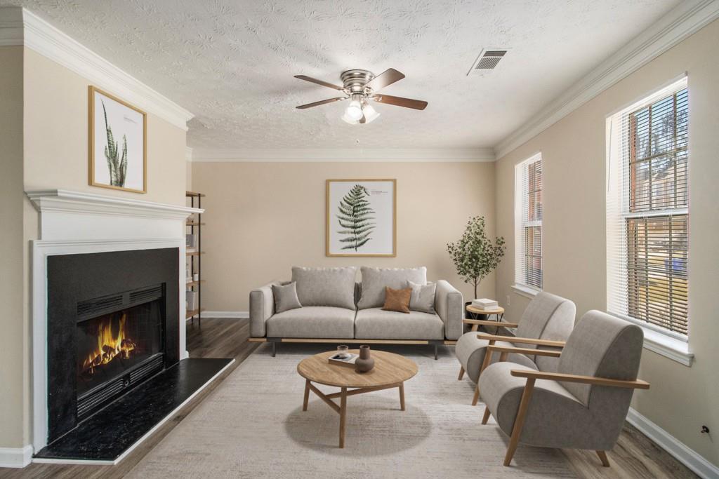 a living room with furniture and a fireplace