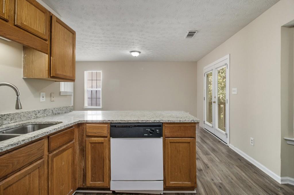 6510 Charter Way Lithonia, GA 30058 - Photo 13 of 27 a kitchen with granite countertop a sink and cabinets