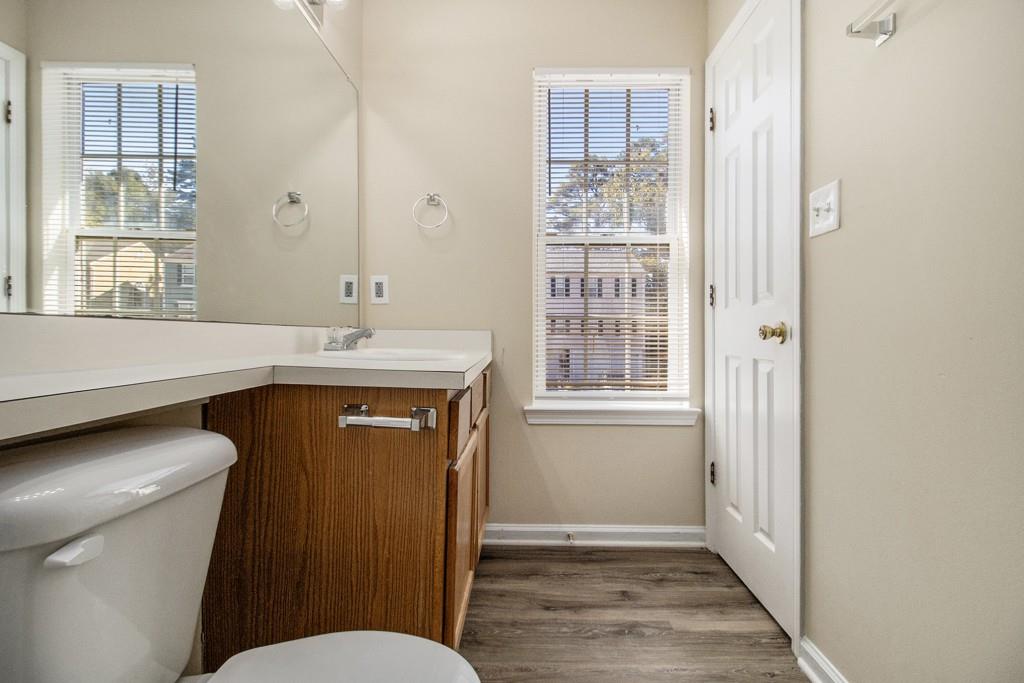 6510 Charter Way Lithonia, GA 30058 - Photo 14 of 27 a bathroom with a sink a toilet a shower and a window