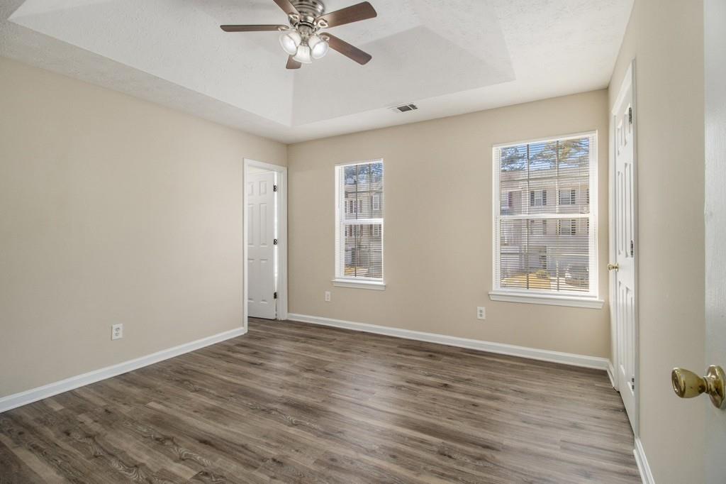 6510 Charter Way Lithonia, GA 30058 - Photo 15 of 27 a view of an empty room with a window and wooden floor