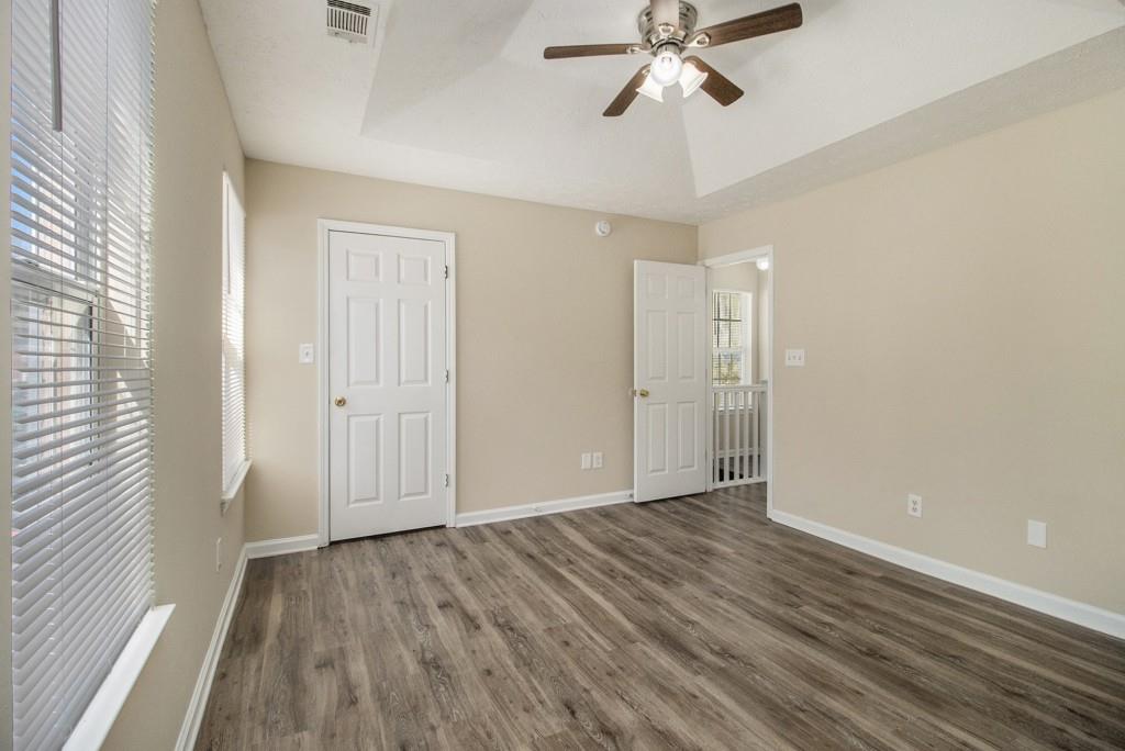 6510 Charter Way Lithonia, GA 30058 - Photo 16 of 27 a view of an empty room with wooden floor and a window