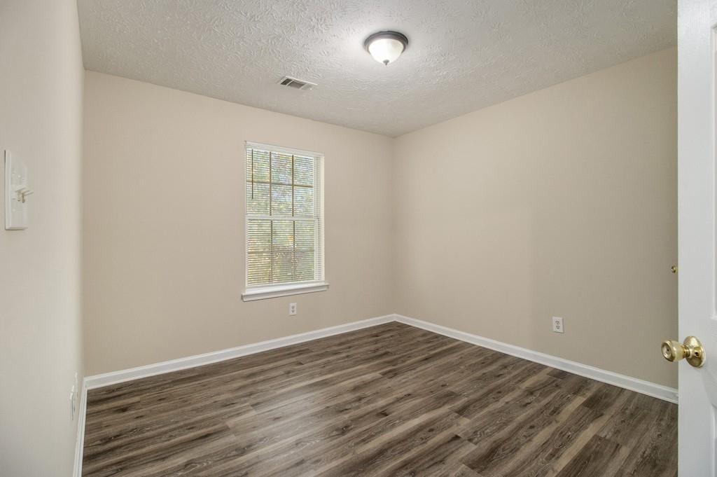 6510 Charter Way Lithonia, GA 30058 - Photo 18 of 27 wooden floor in an empty room with a window