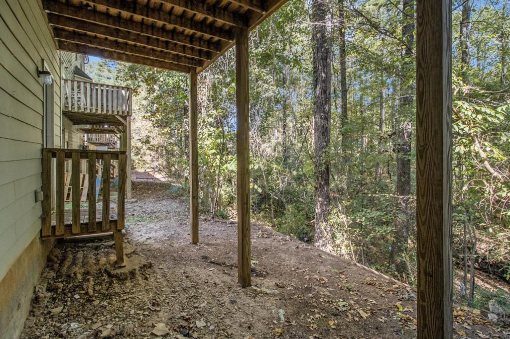 6510 Charter Way Lithonia, GA 30058 - Photo 23 of 27 a backyard of a house with lots of green space