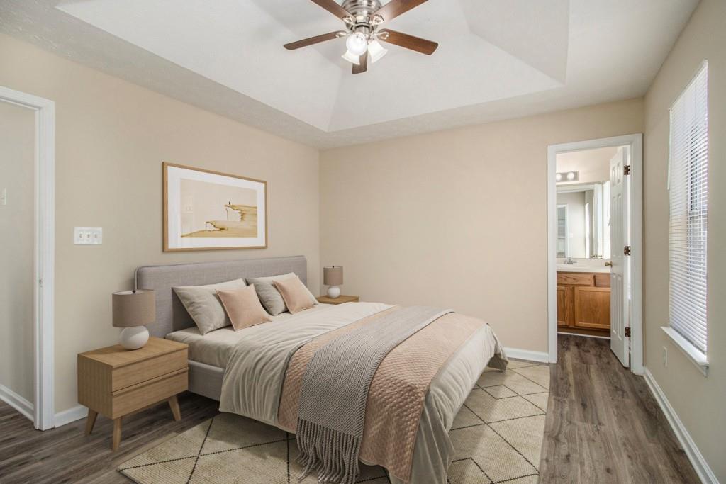 6510 Charter Way Lithonia, GA 30058 - Photo 4 of 27 a bedroom with a bed and a chandelier