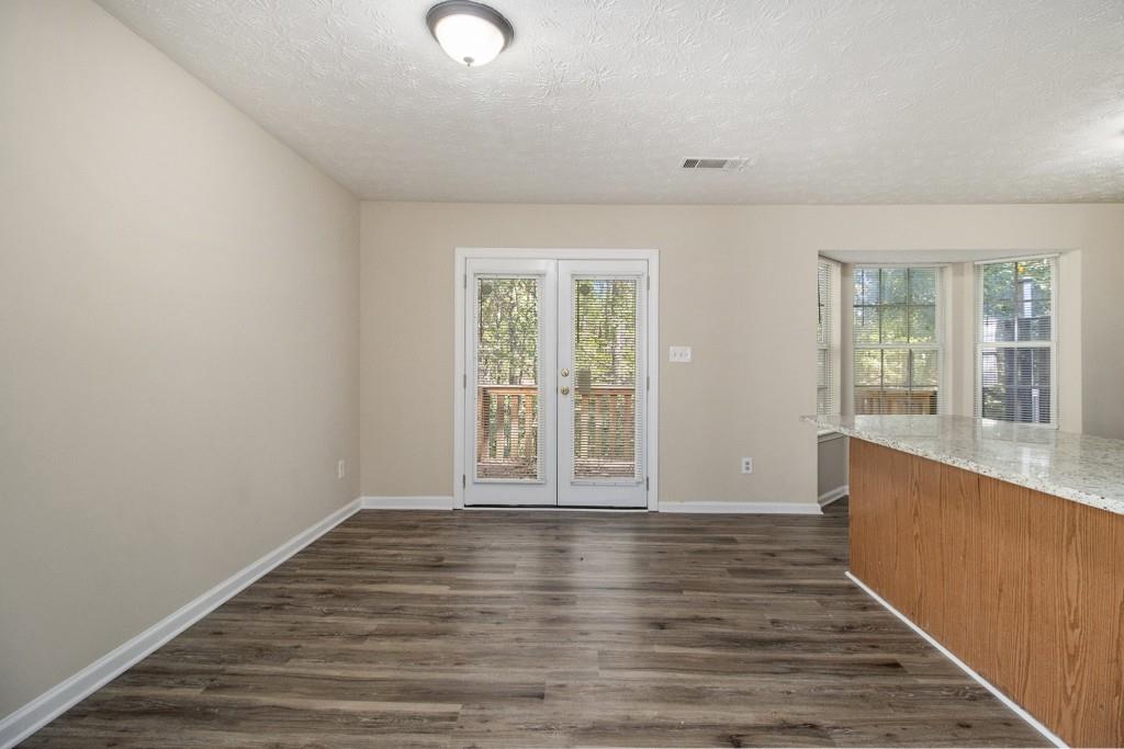 6510 Charter Way Lithonia, GA 30058 - Photo 8 of 27 wooden floor in an empty room with a window