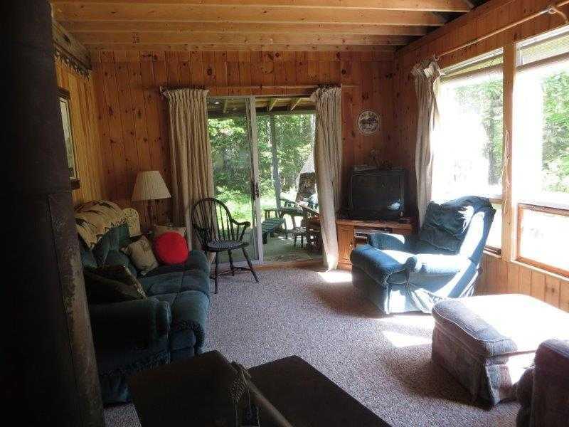 57 Moose Road Oquossoc, ME 04964 - Photo 5 of 18 Living Room.