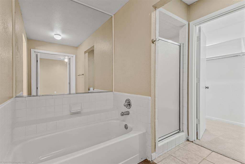 925 Signal Ridge Place Rockwall, TX 75032 - Photo 14 of 21 a bathroom with a bathtub